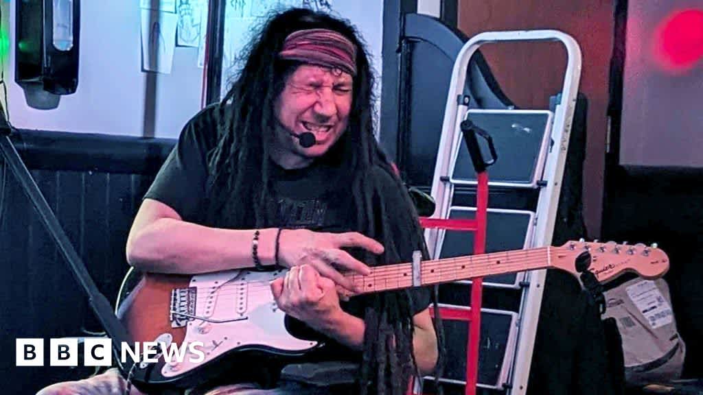 ‘I learned to play guitar with one arm after a stroke’