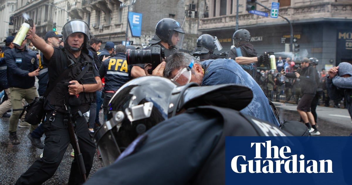 Photographer in coma after Argentina police hit pensioner protest hard