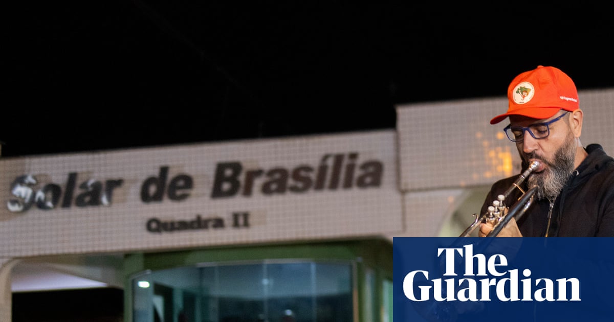 ‘I’m holding his political wake’: the trumpeter waiting to mark Bolsonaro’s judgment day